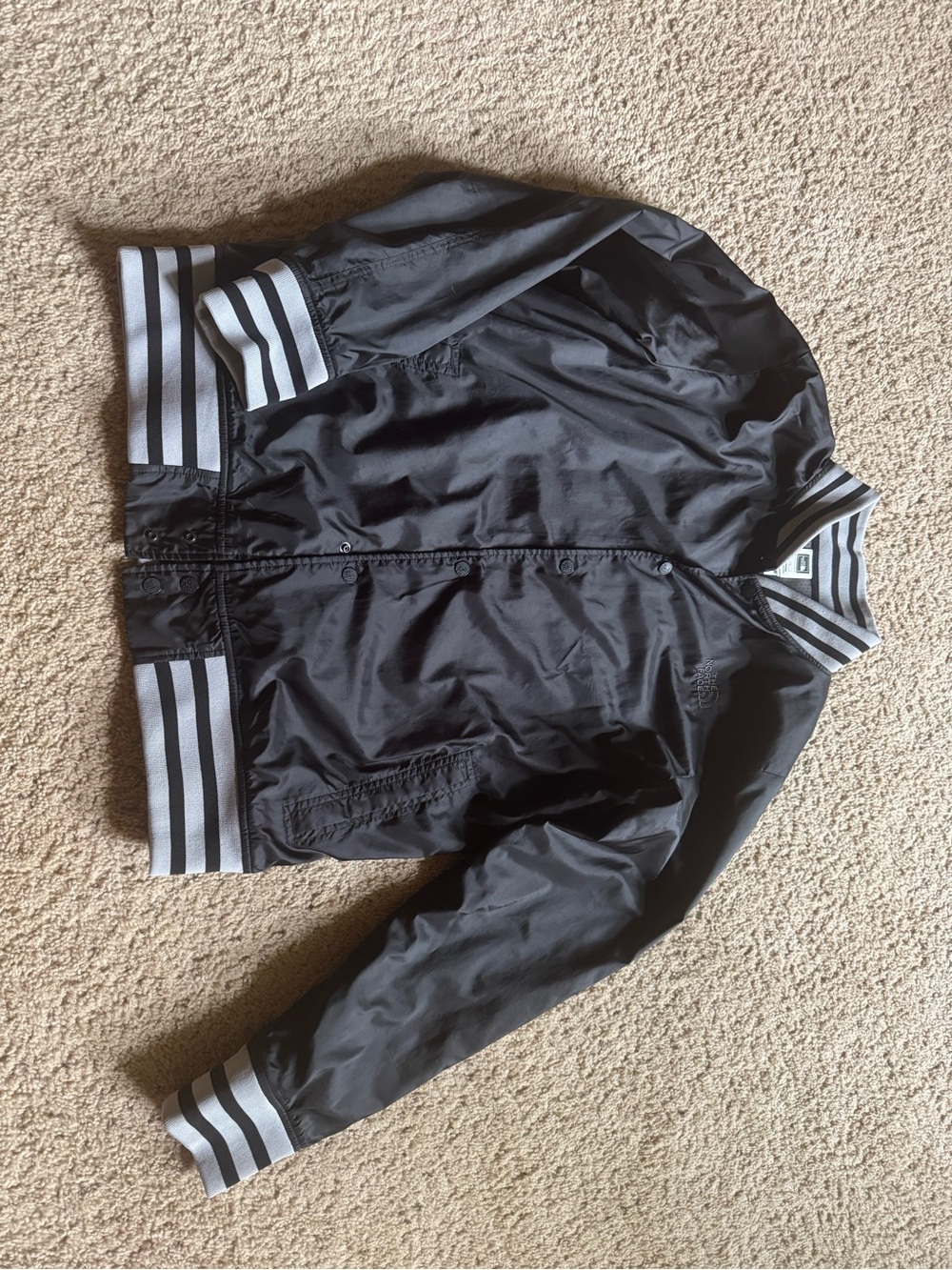 The North Face Black Bomber Jacket with Gray/Black Striped Trim